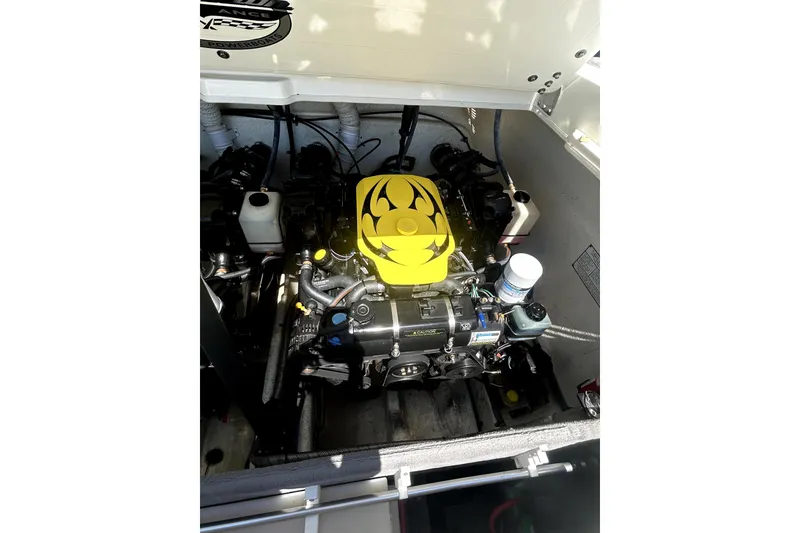 Slide: The Image of 2007 Sunsation 32 Dominator engine compartment with vibrant yellow engine cover. - 26