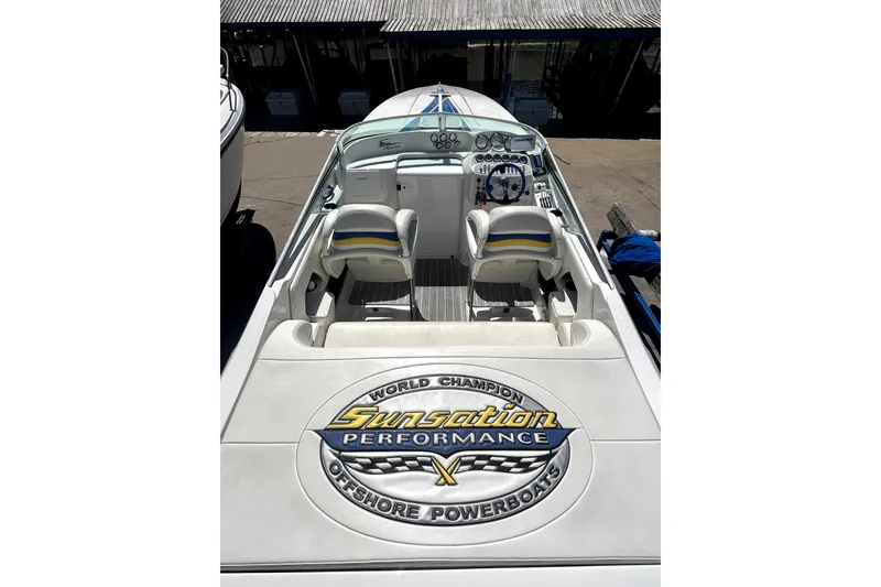 Slide: The Image of 2007 Sunsation 32 Dominator boat interior with branded seating and dashboard. - 6