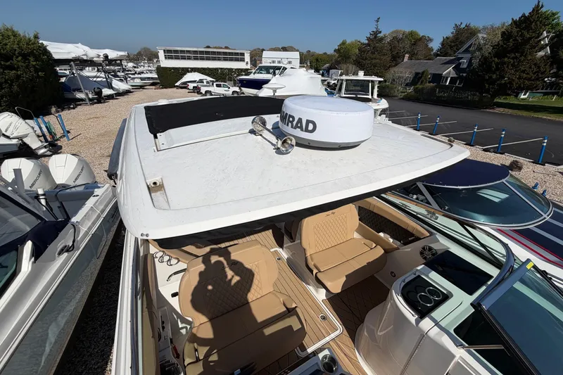 Slide: The Image of 2023 Sea Ray SLX 350 Outboard boat with spacious seating and modern design. - 10