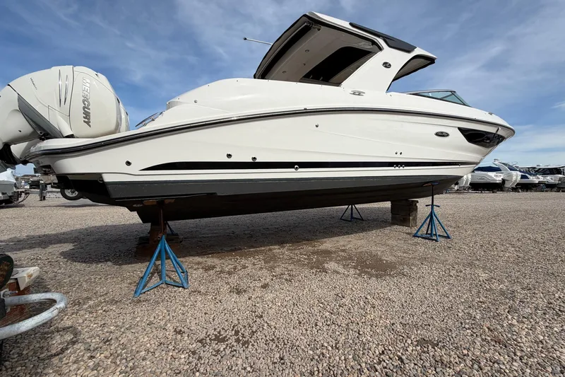 Slide: The Image of 2023 Sea Ray SLX 350 Outboard boat on stands, displayed outdoors. - 31
