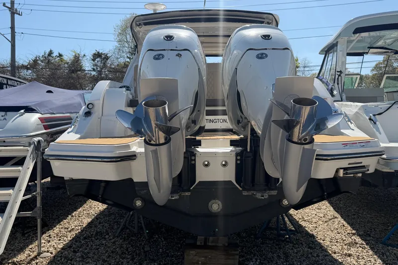 Slide: The Image of 2023 Sea Ray SLX 350 Outboard with dual engines, displayed on gravel lot. - 5