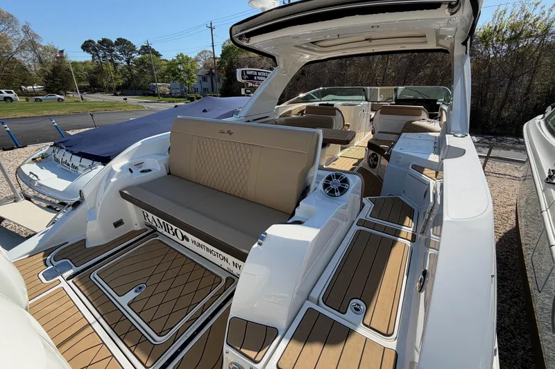 Slide: The Image of 2023 Sea Ray SLX 350 Outboard boat with luxurious seating and sleek design. - 7