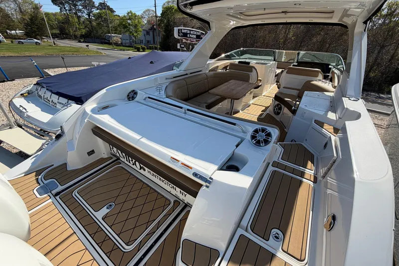 Slide: The Image of 2023 Sea Ray SLX 350 Outboard boat with spacious deck and seating area. - 8