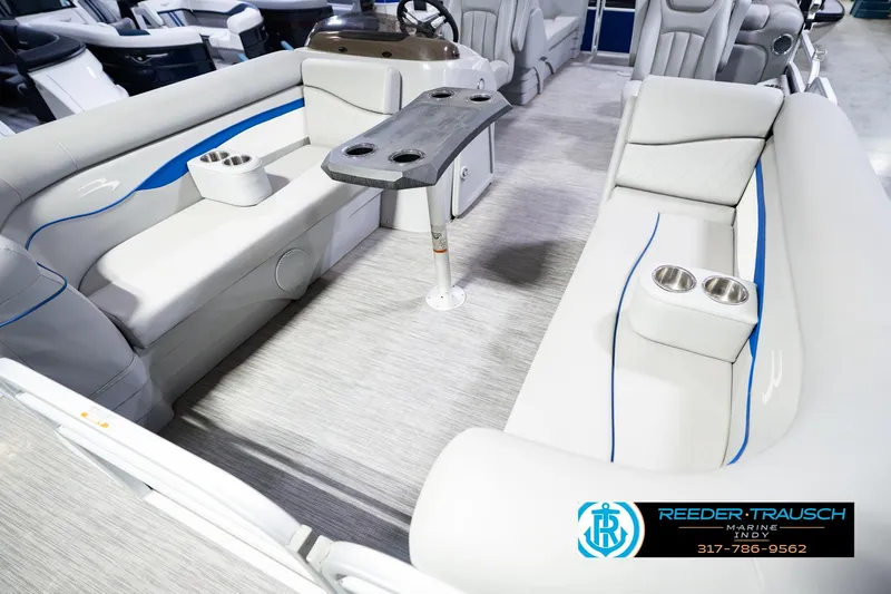 Slide: The Image of 2021 Bennington 22 SVSR boat interior with gray seating and cup holders. - 13