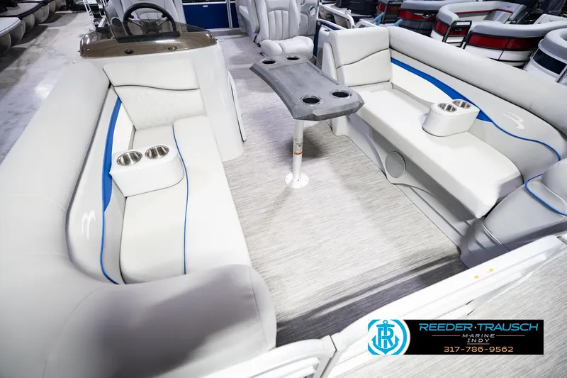 Slide: The Image of 2021 Bennington 22 SVSR pontoon boat interior with gray seating and cup holders. - 14