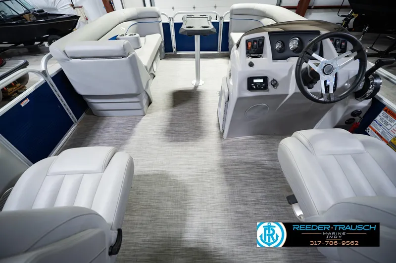 Slide: The Image of 2021 Bennington 22 SVSR pontoon boat interior with plush seating and modern helm. - 24