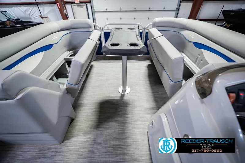 Slide: The Image of Interior of a 2021 Bennington 22 SVSR pontoon boat with seating and table. - 26