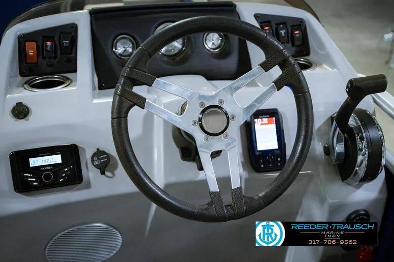Slide: The Image of Steering console of 2021 Bennington 22 SVSR boat with controls and display. - 36