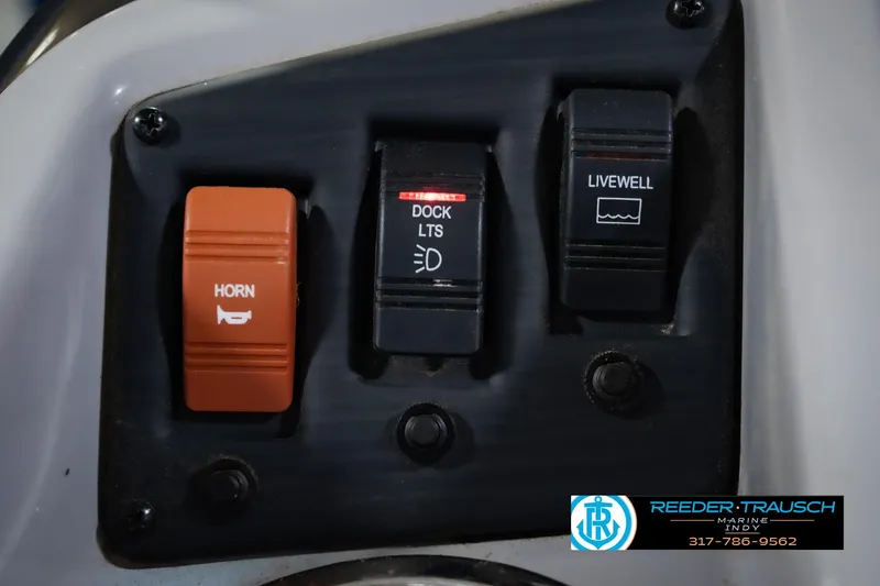 Slide: The Image of Control panel of a 2021 Bennington 22 SVSR boat with horn, dock lights, and livewell switches. - 39