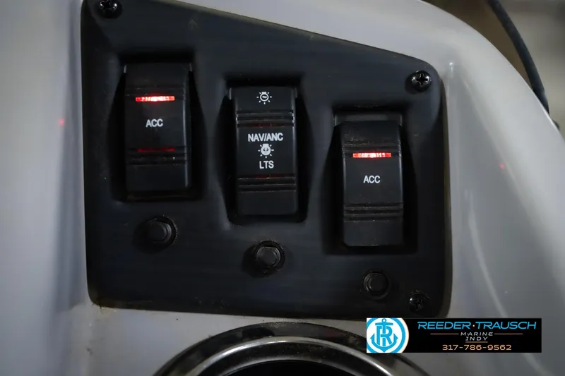 Slide: The Image of Control panel of a 2021 Bennington 22 SVSR boat with accessory switches. - 43
