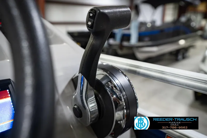 Slide: The Image of Close-up of throttle control on 2021 Bennington 22 SVSR boat, Reeder Trausch Marine logo visible. - 45
