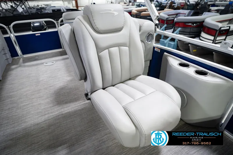 Slide: The Image of Luxurious seating on 2021 Bennington 22 SVSR pontoon boat, featuring plush upholstery and cup holders. - 48