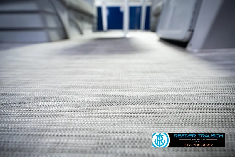 Slide: The Image of 2021 Bennington 22 SVSR boat interior flooring, showcasing textured design. - 53
