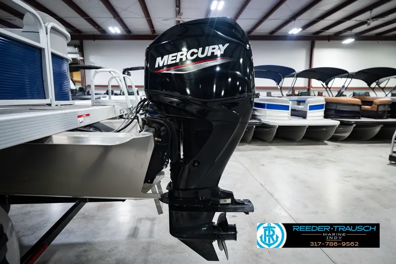 Slide: The Image of 2021 Bennington 22 SVSR pontoon boat with Mercury outboard motor in showroom. - 54
