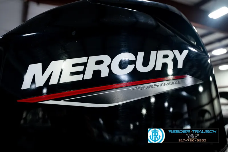 Slide: The Image of Mercury FourStroke engine on 2021 Bennington 22 SVSR boat, indoor setting. - 55