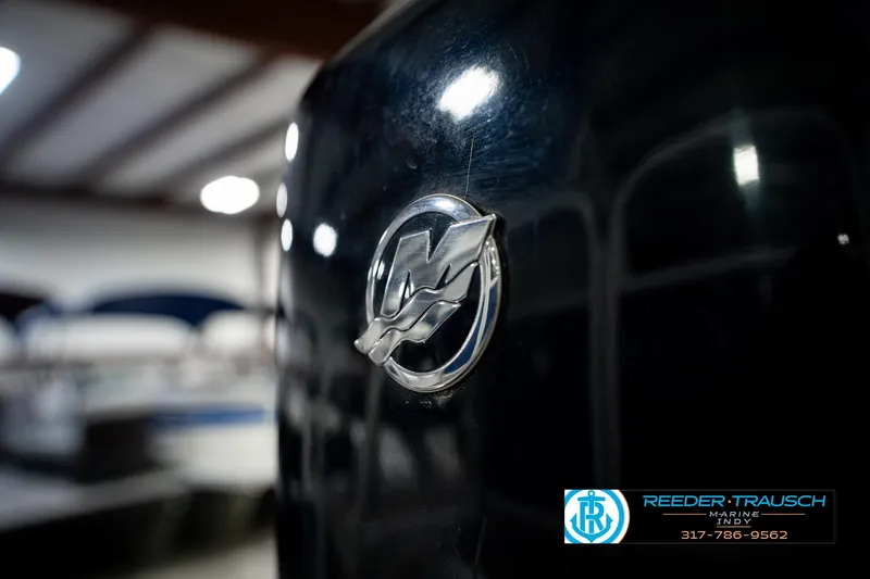Slide: The Image of 2021 Bennington 22 SVSR boat emblem in showroom with Reeder-Trausch Marine logo. - 57