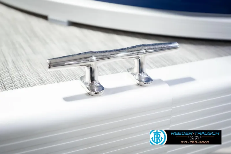 Slide: The Image of Chrome cleat on 2021 Bennington 22 SVSR boat deck, Reeder-Trausch Marine logo visible. - 64