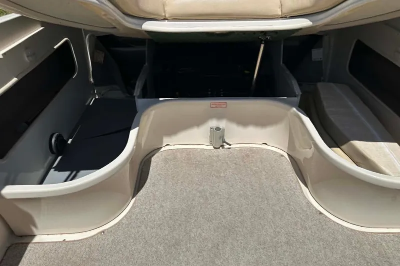 Slide: The Image of 2001 Sea Ray 260 Bow Rider interior storage compartment with open hatch. - 17