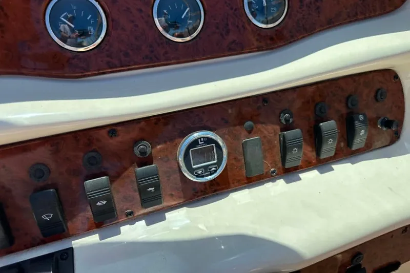 Slide: The Image of Dashboard controls of a 2001 Sea Ray 260 Bow Rider boat. - 22