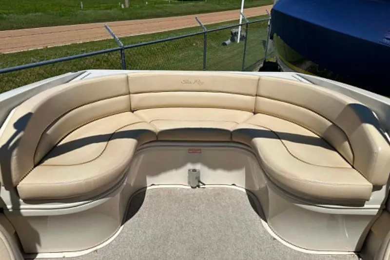 Slide: The Image of 2001 Sea Ray 260 Bow Rider with beige seating, showcasing spacious and comfortable design. - 3