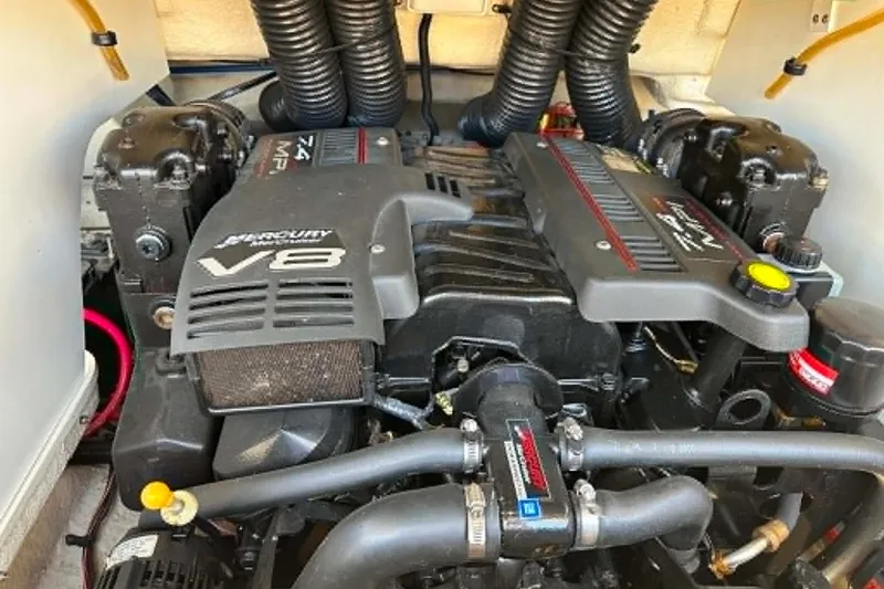 Slide: The Image of Engine of a 2001 Sea Ray 260 Bow Rider boat, featuring a powerful V8 Mercury motor. - 30