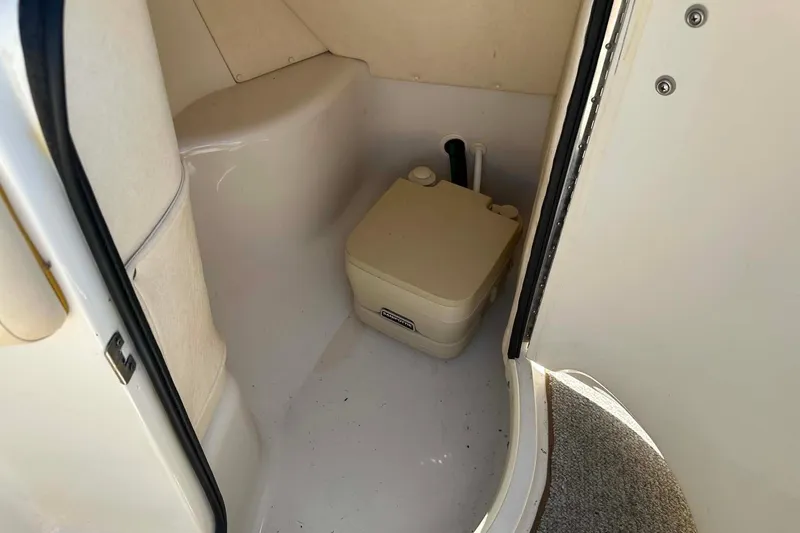 Slide: The Image of Interior of 2001 Sea Ray 260 Bow Rider with portable toilet. - 5
