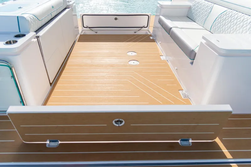 Slide: The Image of Luxurious deck of 2026 Regal 43 SAV boat with elegant seating and wood finish. - 10