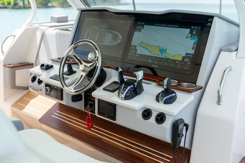 Slide: The Image of Helm of 2026 Regal 43 SAV yacht with advanced navigation system and controls. - 15