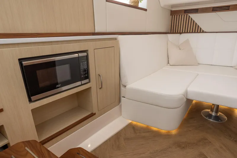 Slide: The Image of Luxurious interior of 2026 Regal 43 SAV yacht with modern kitchenette and seating area. - 23