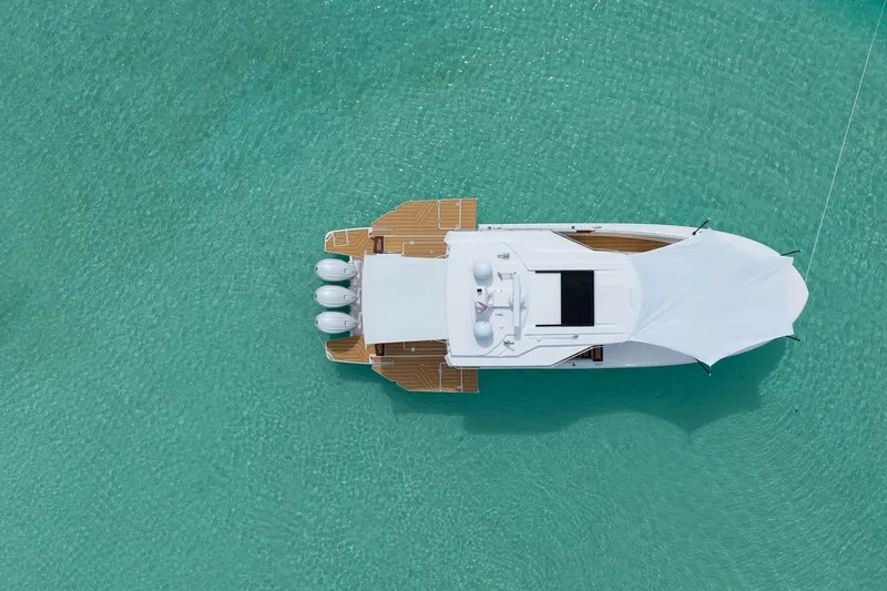 Slide: The Image of Aerial view of 2026 Regal 43 SAV yacht on turquoise water. - 4