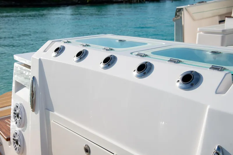 Slide: The Image of 2026 Regal 43 SAV boat deck with fishing rod holders and storage compartments. - 9