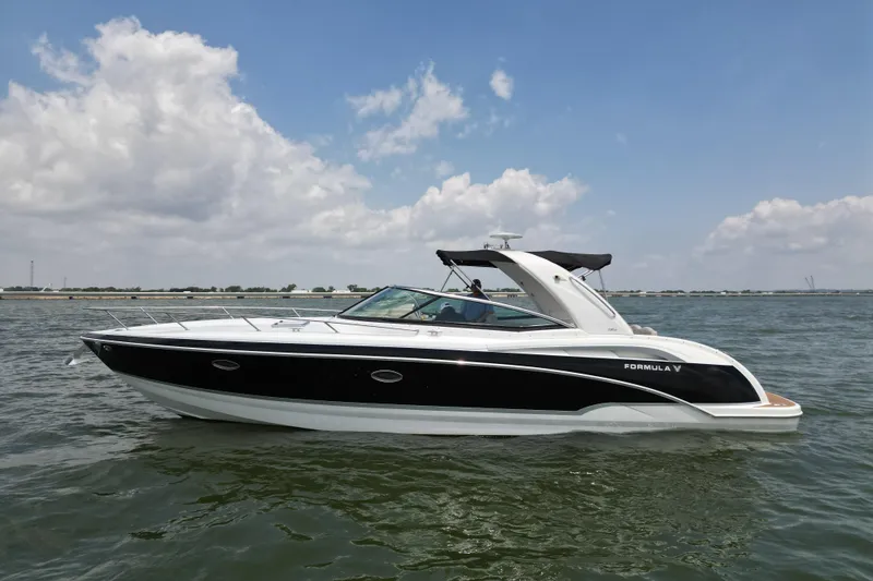 The Image of 2008 Formula 350 Sun Sport boat cruising on open water under a partly cloudy sky. - 0