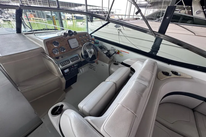 Slide: The Image of 2008 Formula 350 Sun Sport boat cockpit with steering wheel and control panel. - 13