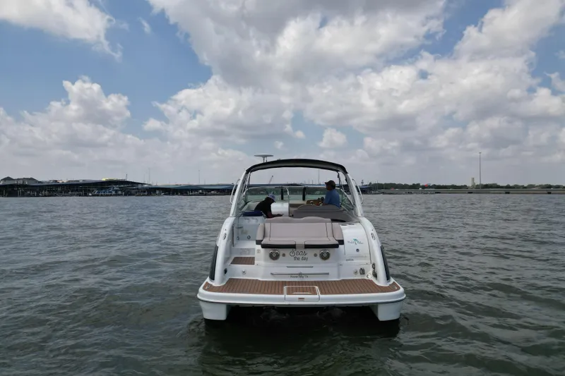 Slide: The Image of 2008 Formula 350 Sun Sport boat on water under cloudy sky. - 2