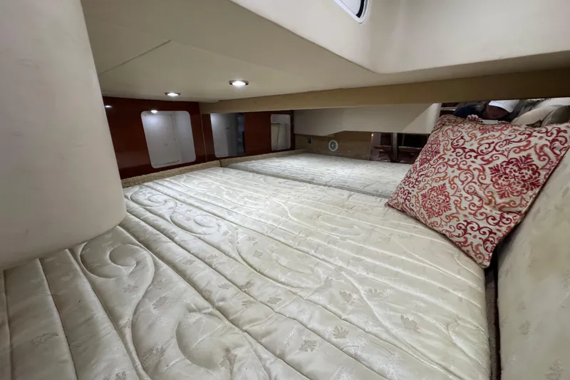 Slide: The Image of Luxurious cabin interior of a 2008 Formula 350 Sun Sport boat with elegant bedding. - 22