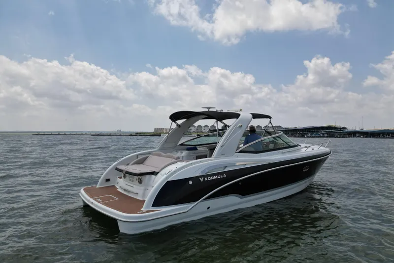 Slide: The Image of 2008 Formula 350 Sun Sport boat cruising on a sunny day with cloudy skies. - 3