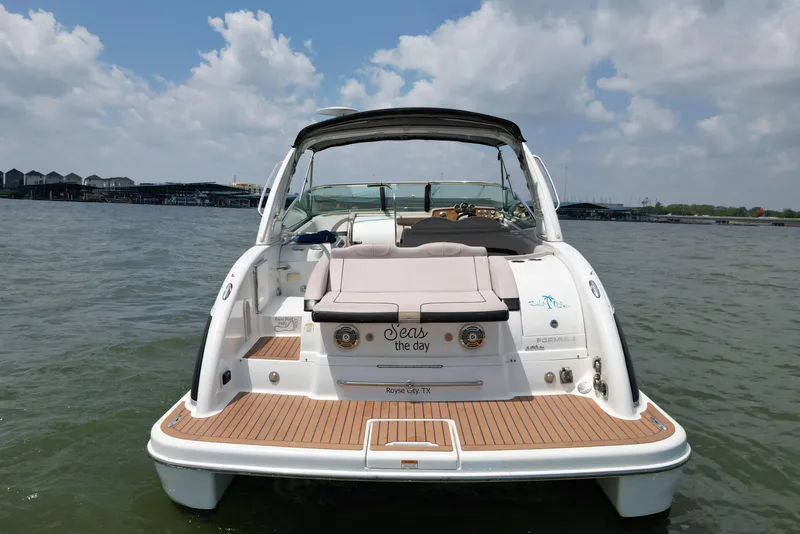 Slide: The Image of 2008 Formula 350 Sun Sport boat on water, rear view, sunny day. - 6