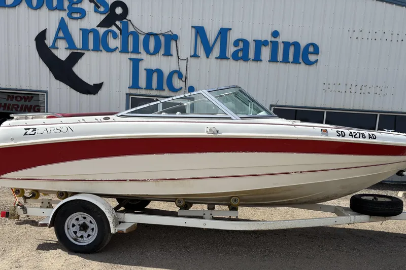 The Image of 1993 Larson SEi 200 Cuddy I/O boat on trailer at Doug's Anchor Marine. - 0