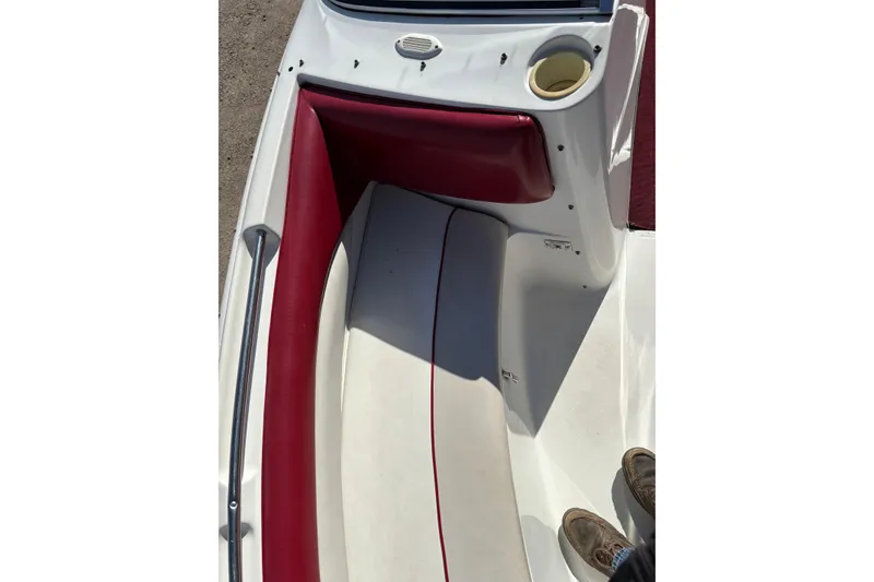 Slide: The Image of 1993 Larson SEi 200 Cuddy I/O boat interior with red and white seating. - 11