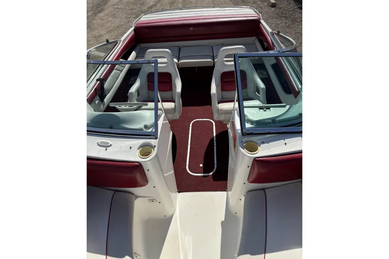 Slide: The Image of 1993 Larson SEi 200 Cuddy I/O boat interior with red and white seating. - 12