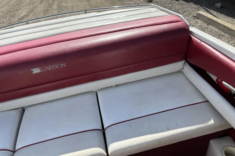 Slide: The Image of Red and white interior of a 1993 Larson SEi 200 Cuddy I/O boat. - 18