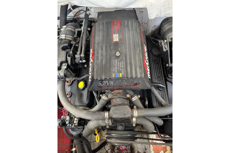 Slide: The Image of Engine of a 1993 Larson SEi 200 Cuddy I/O boat, featuring MerCruiser 5.7 V8. - 19