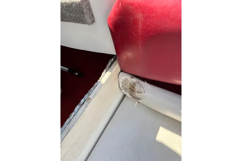 Slide: The Image of Damaged interior upholstery of a 1993 Larson SEi 200 Cuddy I/O boat. - 22