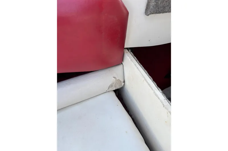Slide: The Image of Interior detail of a 1993 Larson SEi 200 Cuddy I/O boat showing seat wear. - 23