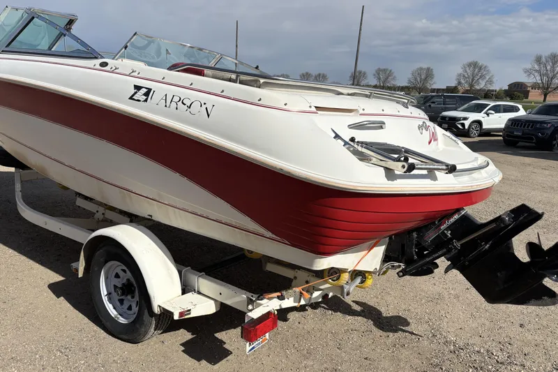 Slide: The Image of 1993 Larson SEi 200 Cuddy I/O boat on trailer, red and white design. - 3