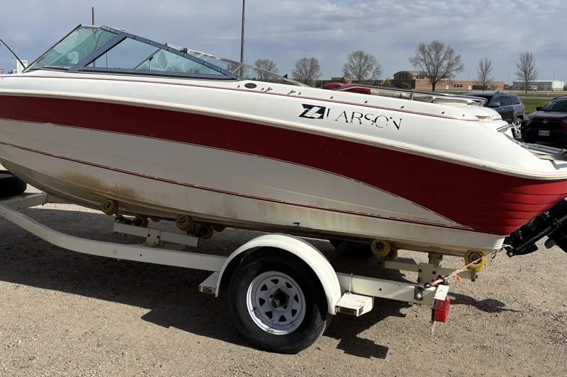 Slide: The Image of 1993 Larson SEi 200 Cuddy I/O boat on trailer, red and white design. - 5