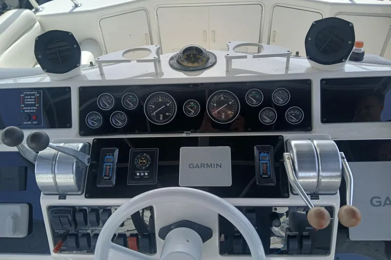 Slide: The Image of Control panel of a 1996 Sea Ray 550 Sedan Bridge with Garmin navigation system. - 4