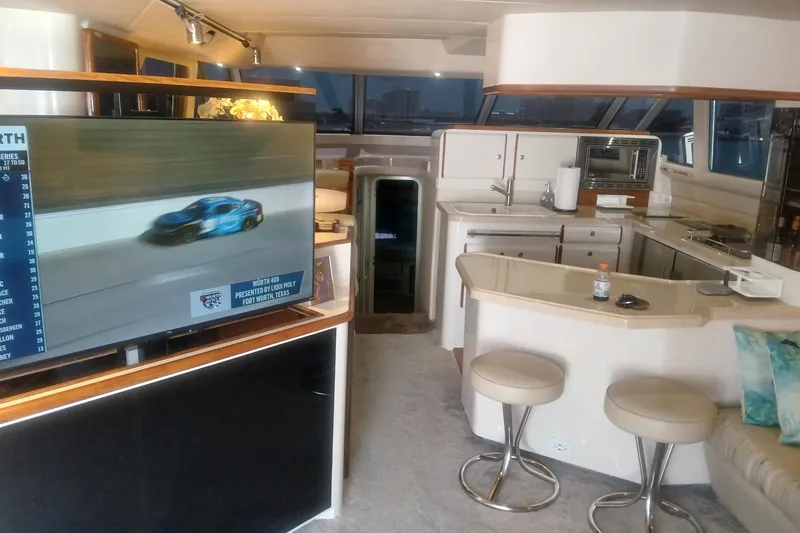 Slide: The Image of Interior of a 1996 Sea Ray 550 Sedan Bridge yacht with modern amenities. - 5