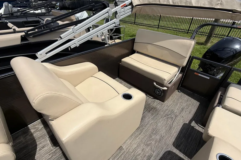 Slide: The Image of Interior seating of 2022 Crest Classic LX 220 pontoon boat with beige upholstery. - 7