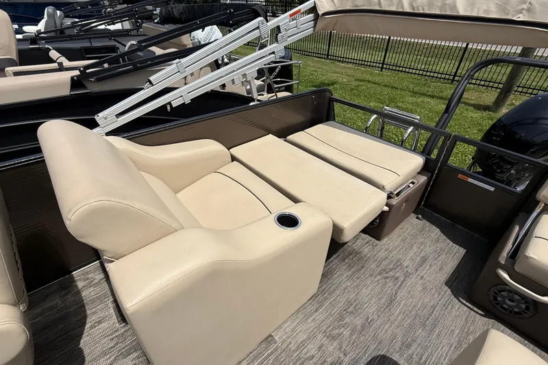 Slide: The Image of 2022 Crest Classic LX 220 boat with beige seating and cup holder. - 9